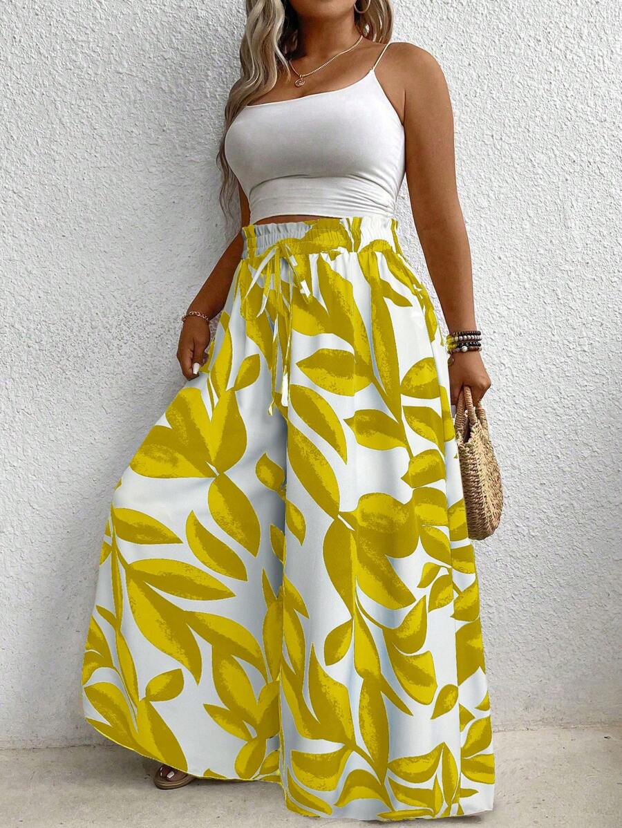 Calça Pantalona Plus Size Floral com Cinto é ideal para mulheres que buscam elegância e conforto em uma única peça. Com modelagem de perna larga e cintura natural, valoriza a silhueta e oferece liberdade de movimento. Seu tecido leve e elástico proporciona um caimento solto e confortável.