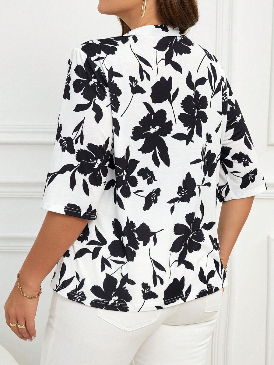 Jaqueta preta e branca plus size, tecido leve e caimento perfeito. Ideal para looks casuais cheios de estilo.