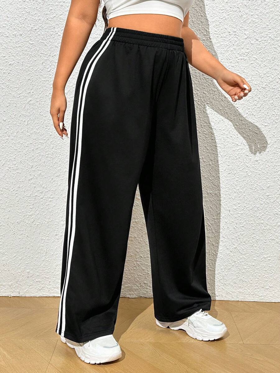 Tecido macio e respirável, cintura elástica e caimento solto. Calça moletom plus size perfeita para looks casuais estilosos.