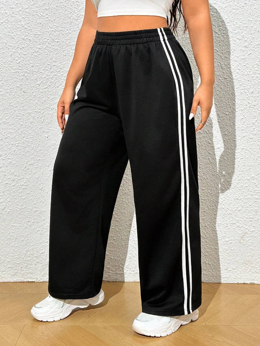 Calça moletom plus size em algodão 100%, cintura elástica e perna larga. Visual moderno e conforto para o dia a dia.