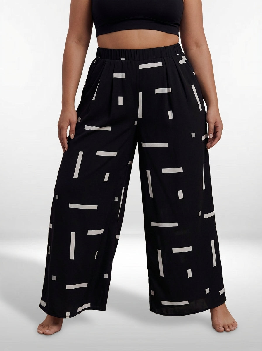 Calça wide leg plus size preto e branco com bolso funcional e tecido elástico